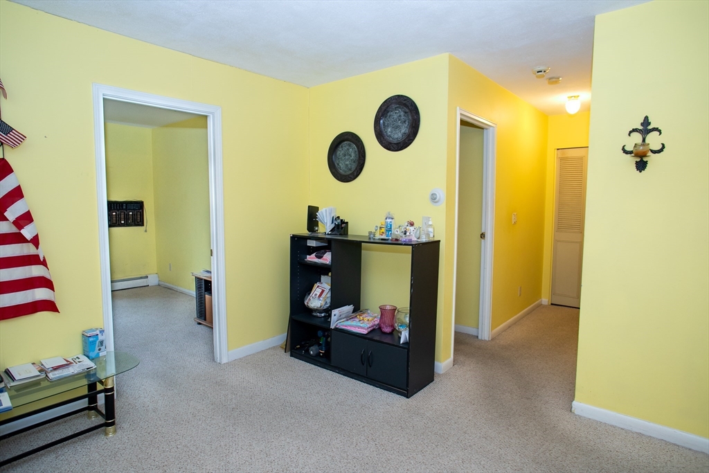 110 Boston Post Road East, Unit 104 Marlborough, MA 01752 - Photo 21 of 28 a view of a room with furniture and front door