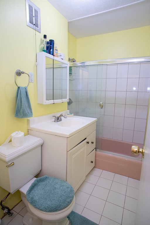 110 Boston Post Road East, Unit 104 Marlborough, MA 01752 - Photo 25 of 28 a bathroom with a sink a toilet and shower