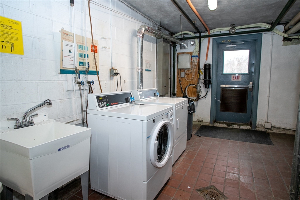 110 Boston Post Road East, Unit 104 Marlborough, MA 01752 - Photo 26 of 28 a utility room with dryer and washer