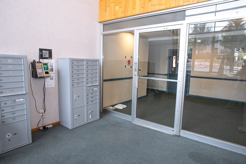 110 Boston Post Road East, Unit 104 Marlborough, MA 01752 - Photo 27 of 28 a view of an empty room and window
