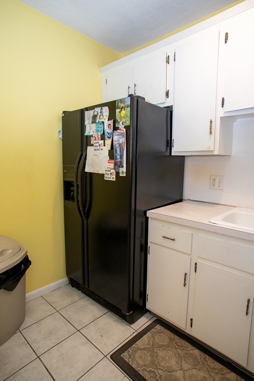 110 Boston Post Road East, Unit 104 Marlborough, MA 01752 - Photo 9 of 28 a kitchen with stainless steel appliances granite countertop a refrigerator and a stove
