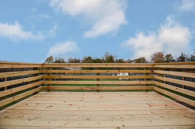 a view of a swimming pool and an outdoor seating