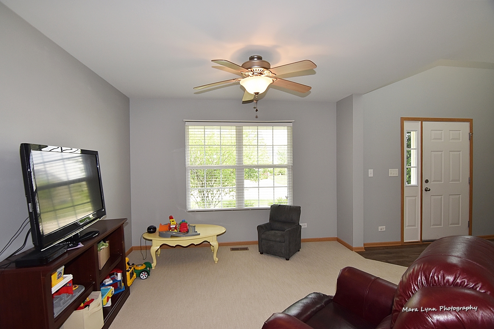 1125 Bailey Road Sycamore, IL 60178 - Photo 6 of 30 a living room with furniture and a flat screen tv