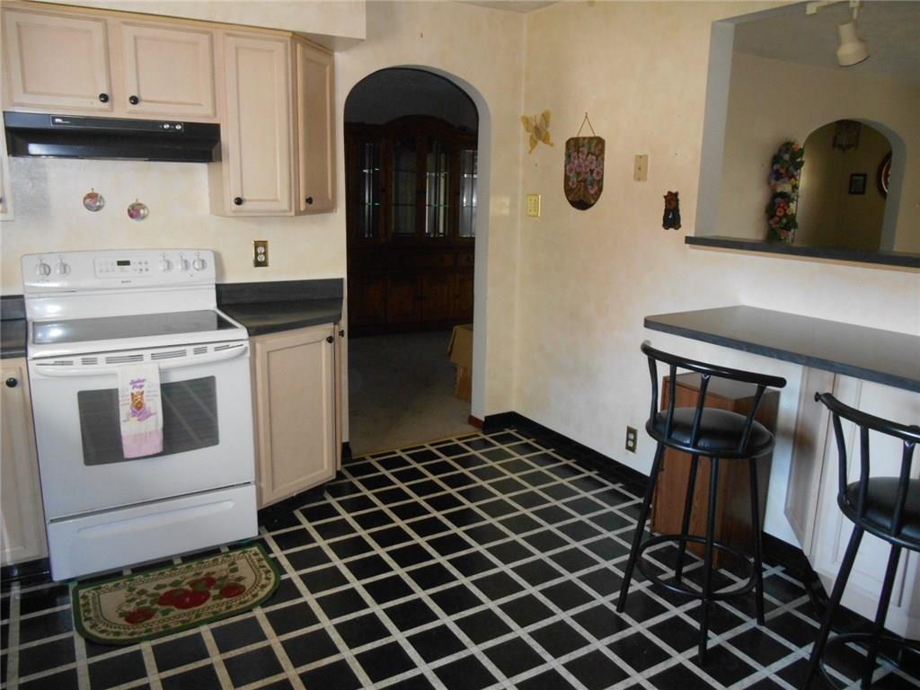1098 Mercer Road Beaver Falls, PA 15010 - Photo 16 of 18 Fully equipped kitchen with electric stove and breakfast bar.