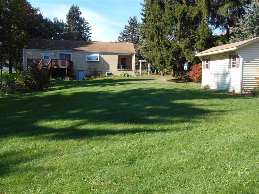 Nice level yard with shed and rear deck.