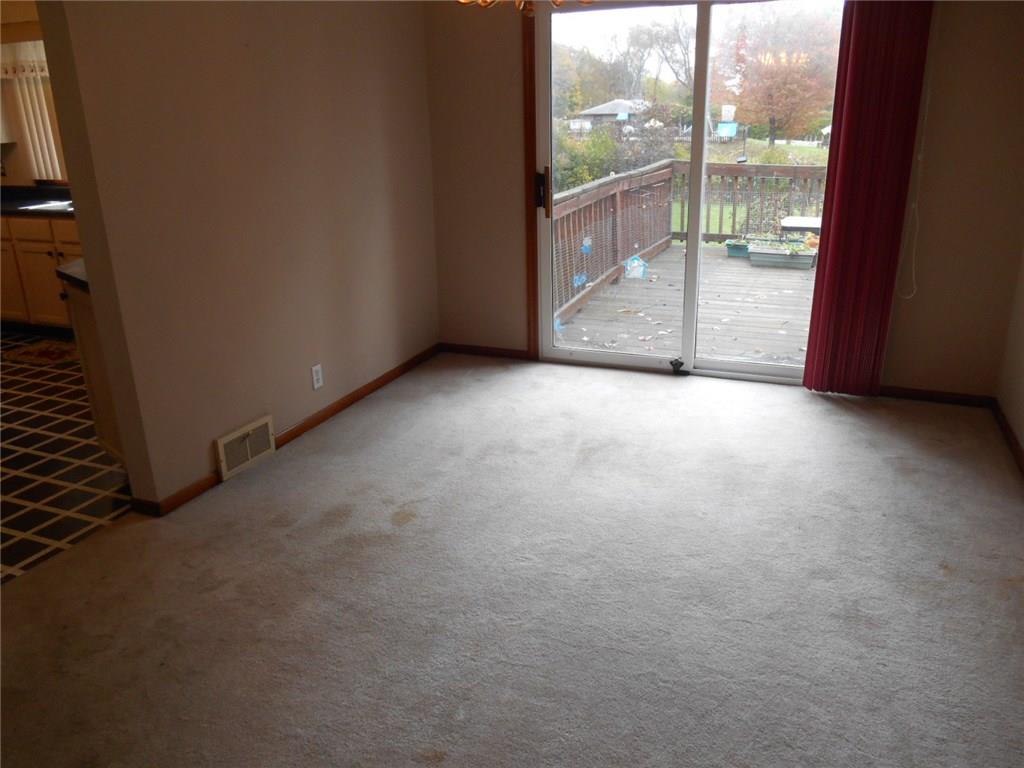 Dining Room with Sliding glass door leading to deck overlooking nice yard.