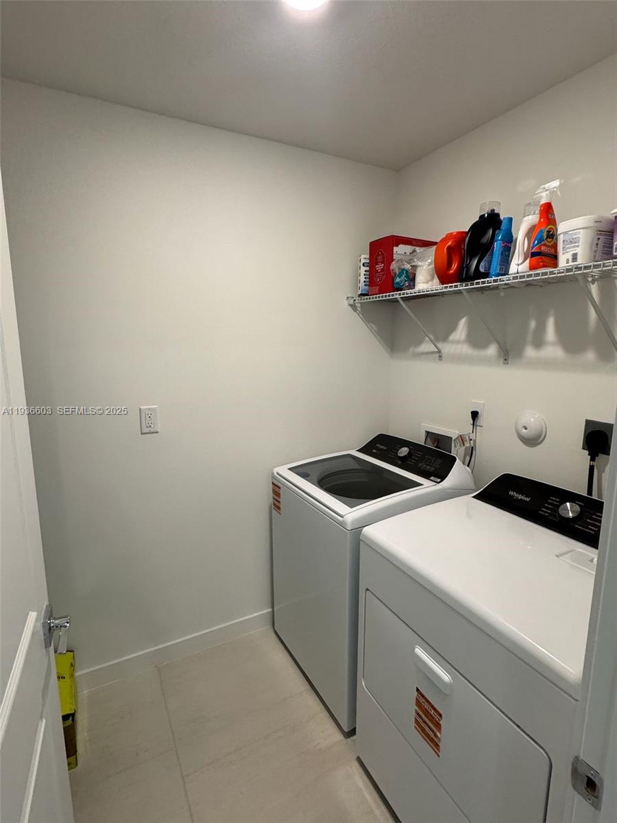 141 Northeast 13th Circle Homestead, FL 33033 - Photo 13 of 19 a utility room with dryer and washer