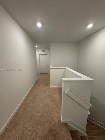 a view of storage and utility room with washer and dryer