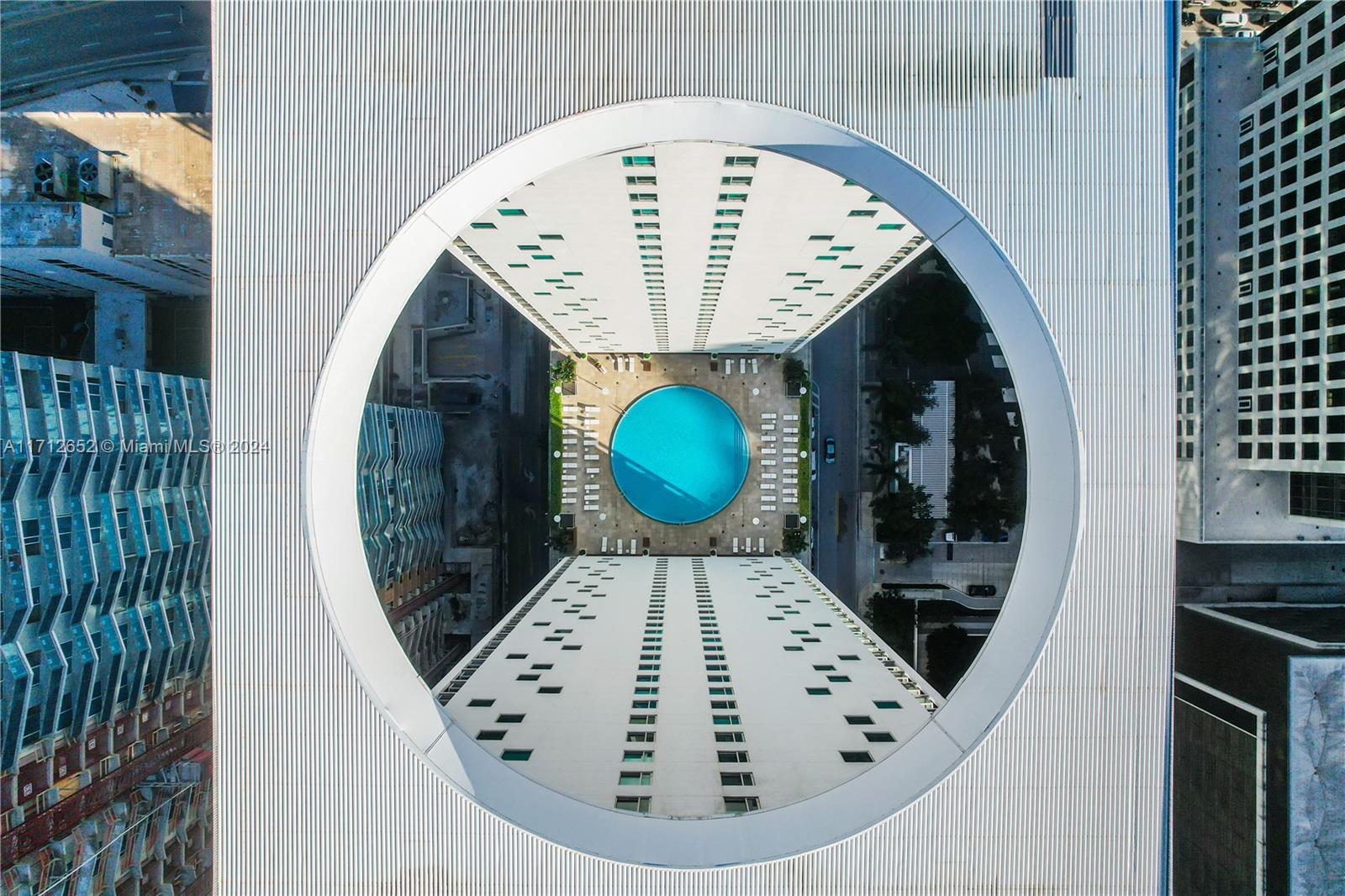 55 Southeast 6th Street, Unit 3407 Miami, FL 33131 - Photo 28 of 33 an aerial view of a kitchen with a fireplace and a chandelier