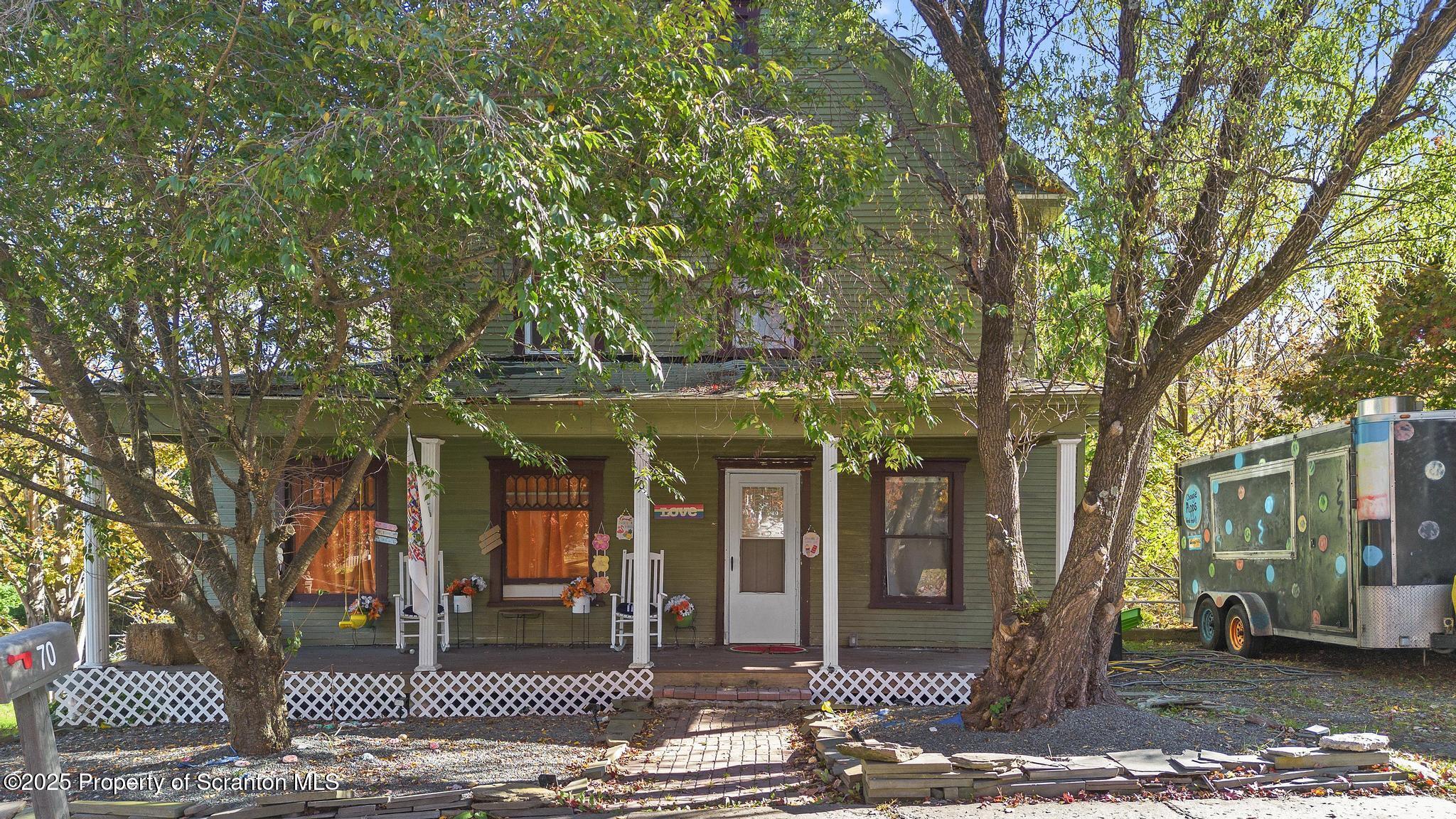 70 State Street Nicholson, PA 18446 - Photo 1 of 64 a front view of a house with a tree