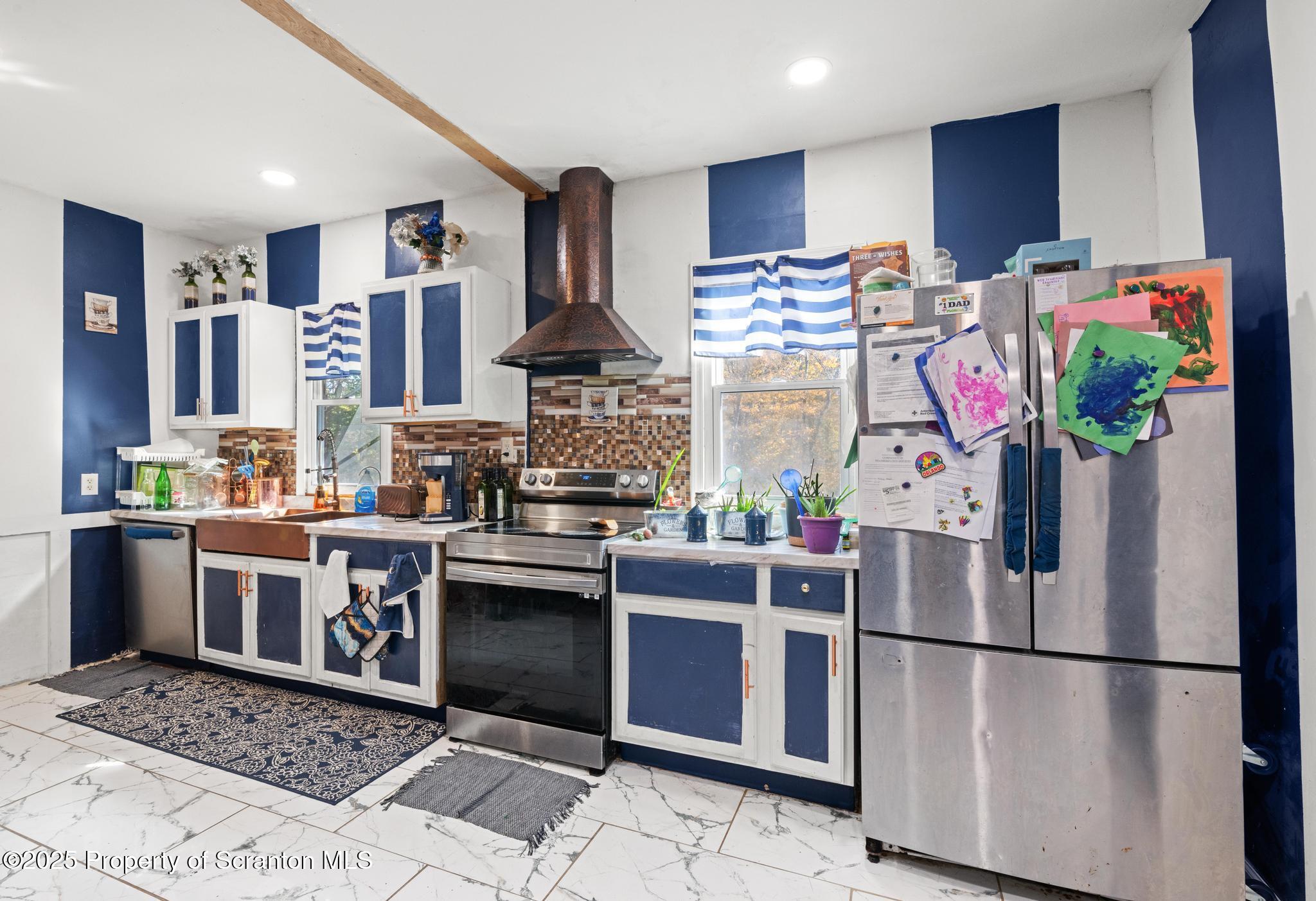 70 State Street Nicholson, PA 18446 - Photo 20 of 64 a kitchen with stainless steel appliances granite countertop a refrigerator and a stove