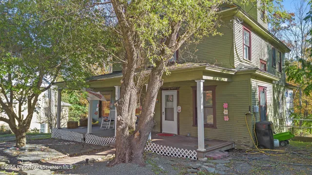 a view of a brick house with many windows