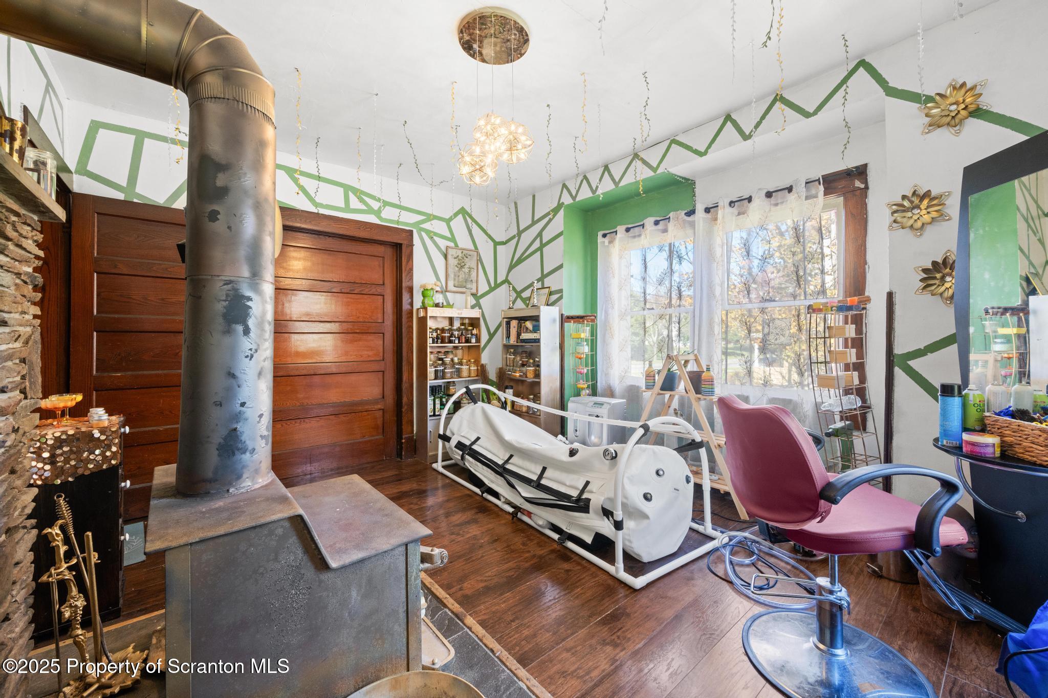 70 State Street Nicholson, PA 18446 - Photo 25 of 64 a living room with furniture windows and a chandelier