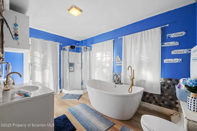 a bed room with a bed and a two chair