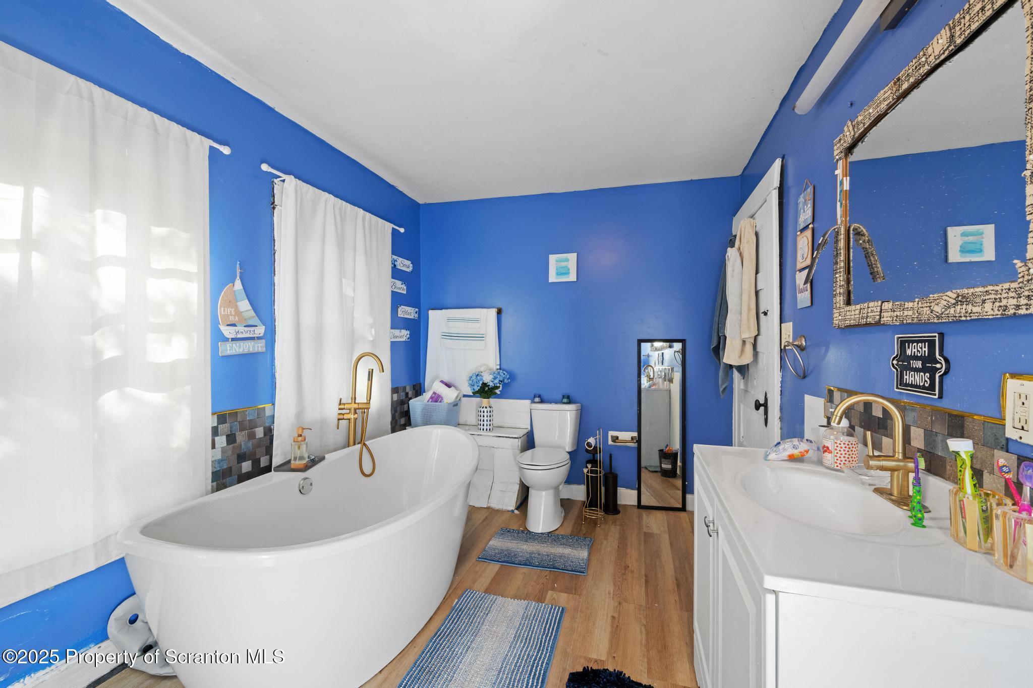 70 State Street Nicholson, PA 18446 - Photo 27 of 64 a living room with furniture and a wooden floor