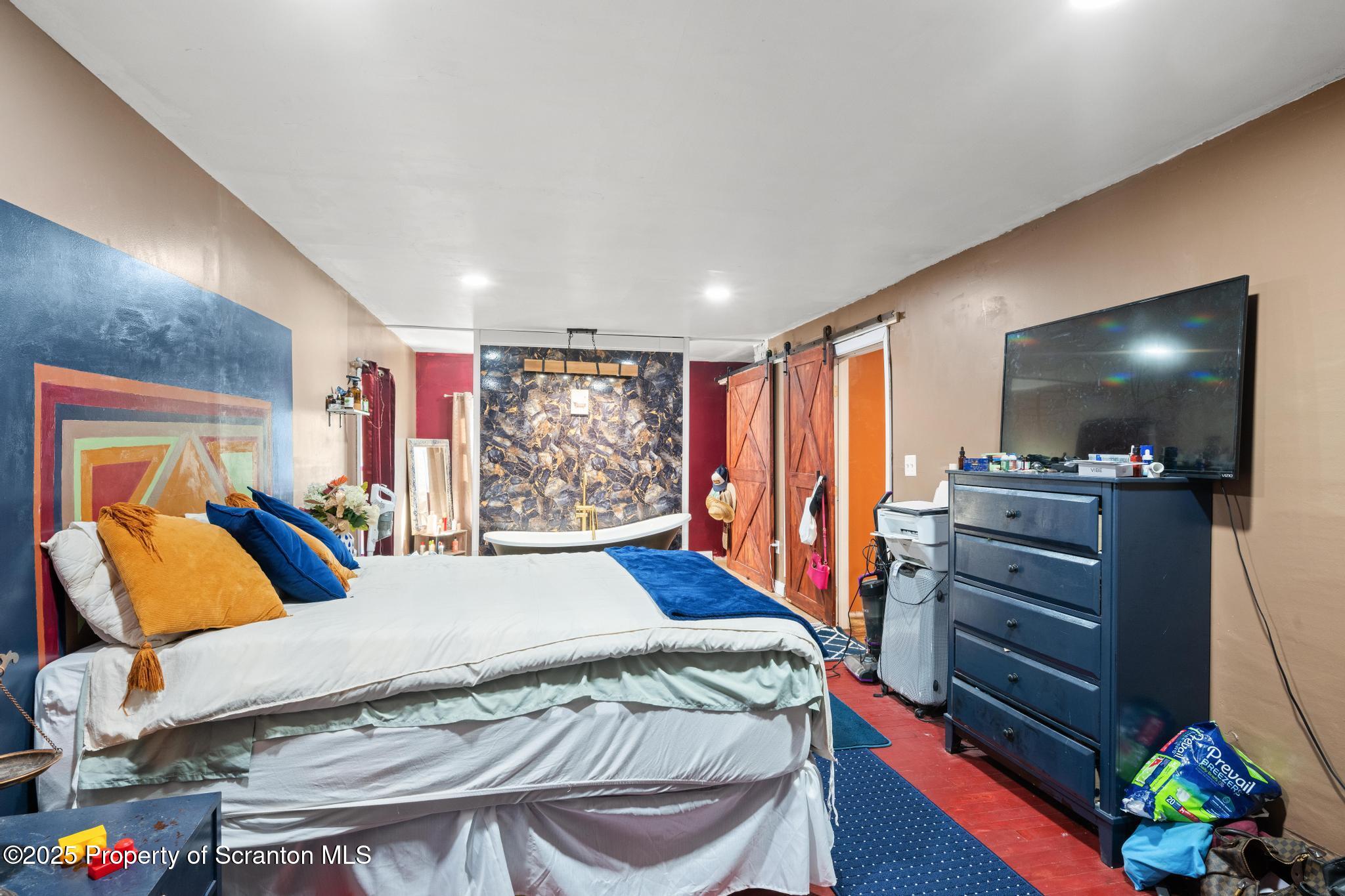 70 State Street Nicholson, PA 18446 - Photo 37 of 64 a bed room with a bed and a television