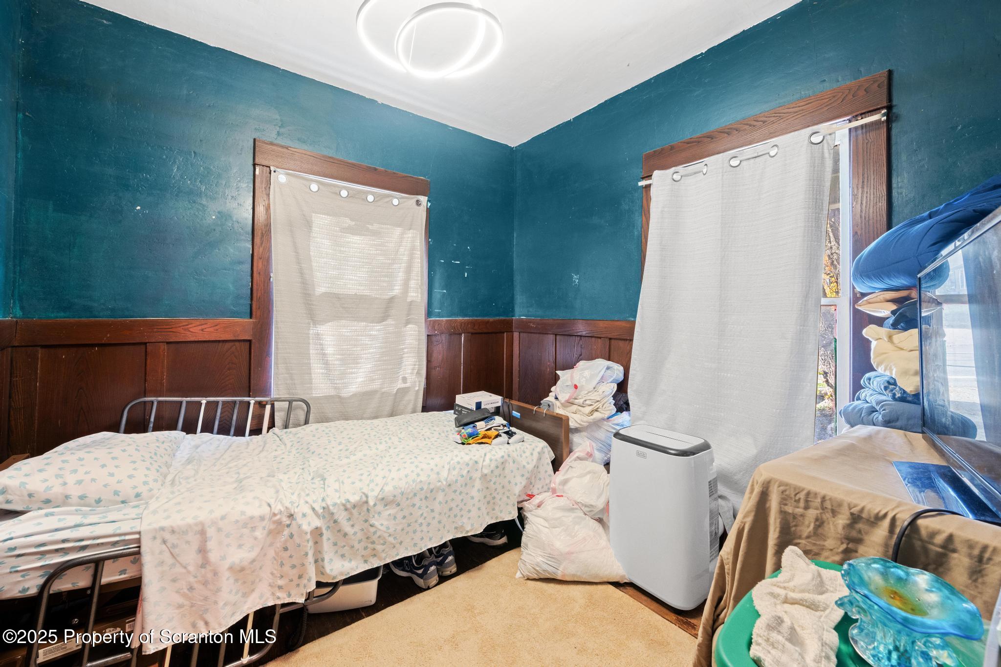 70 State Street Nicholson, PA 18446 - Photo 38 of 64 a bedroom with a bed and wooden floor