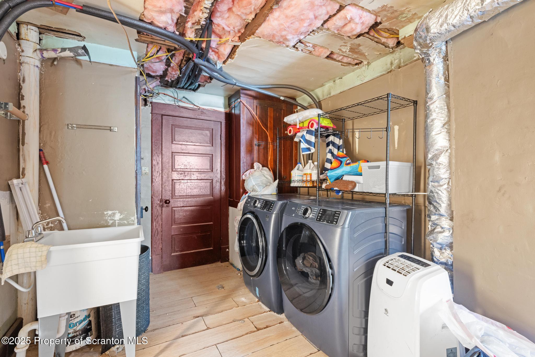 70 State Street Nicholson, PA 18446 - Photo 45 of 64 a view of a storage & utility room with washer and dryer