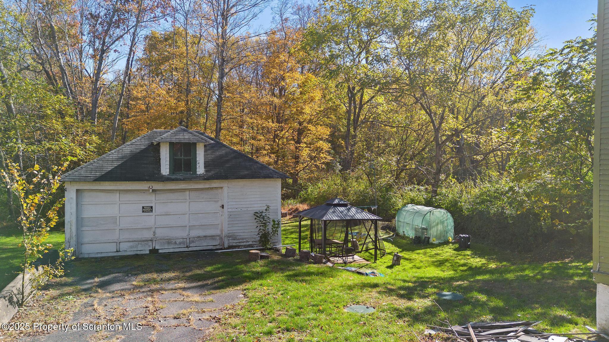 70 State Street Nicholson, PA 18446 - Photo 51 of 64 a front view of a house with a yard