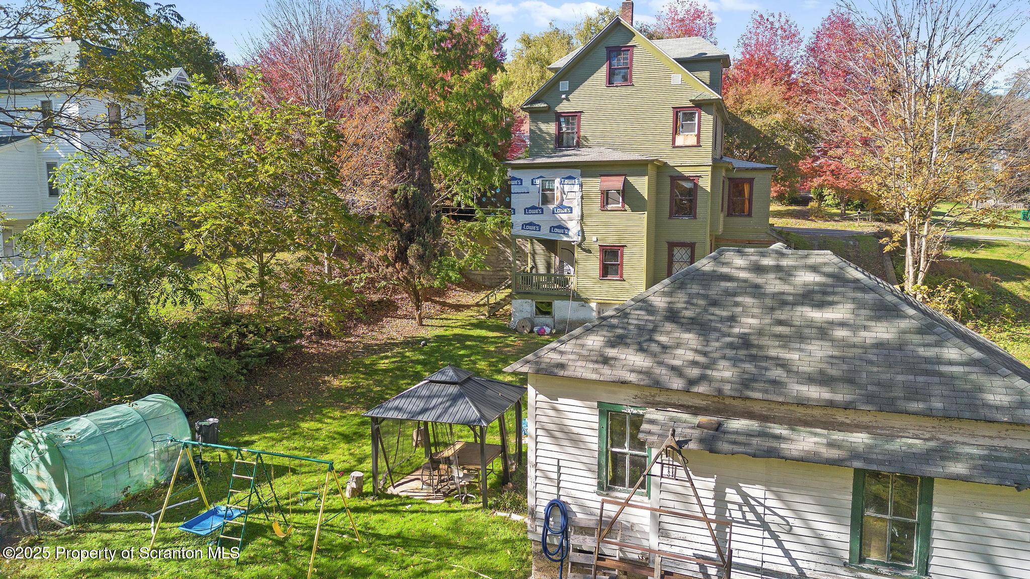 70 State Street Nicholson, PA 18446 - Photo 53 of 64 a front view of a house with a yard