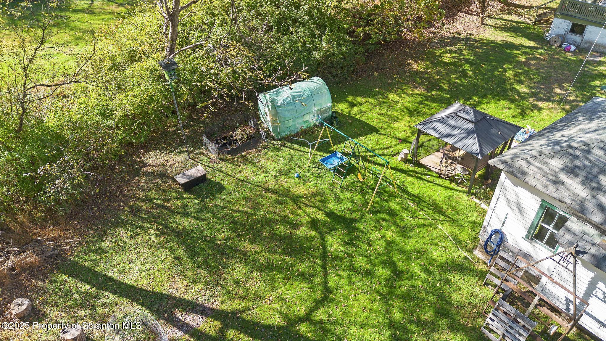 70 State Street Nicholson, PA 18446 - Photo 54 of 64 a backyard of a house with lots of green space