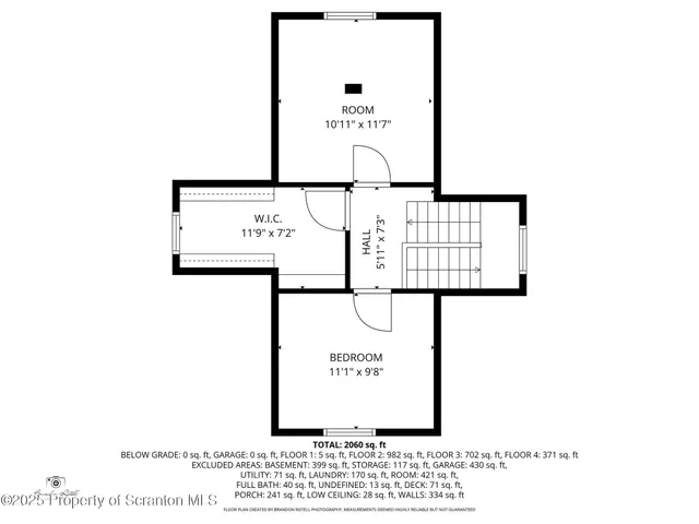 a living room with furniture a flat screen tv and a window