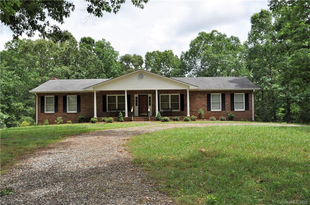 280 Bennett Road Rutherfordton, NC 28139 - Photo 1 of 44 a front view of a house with a garden