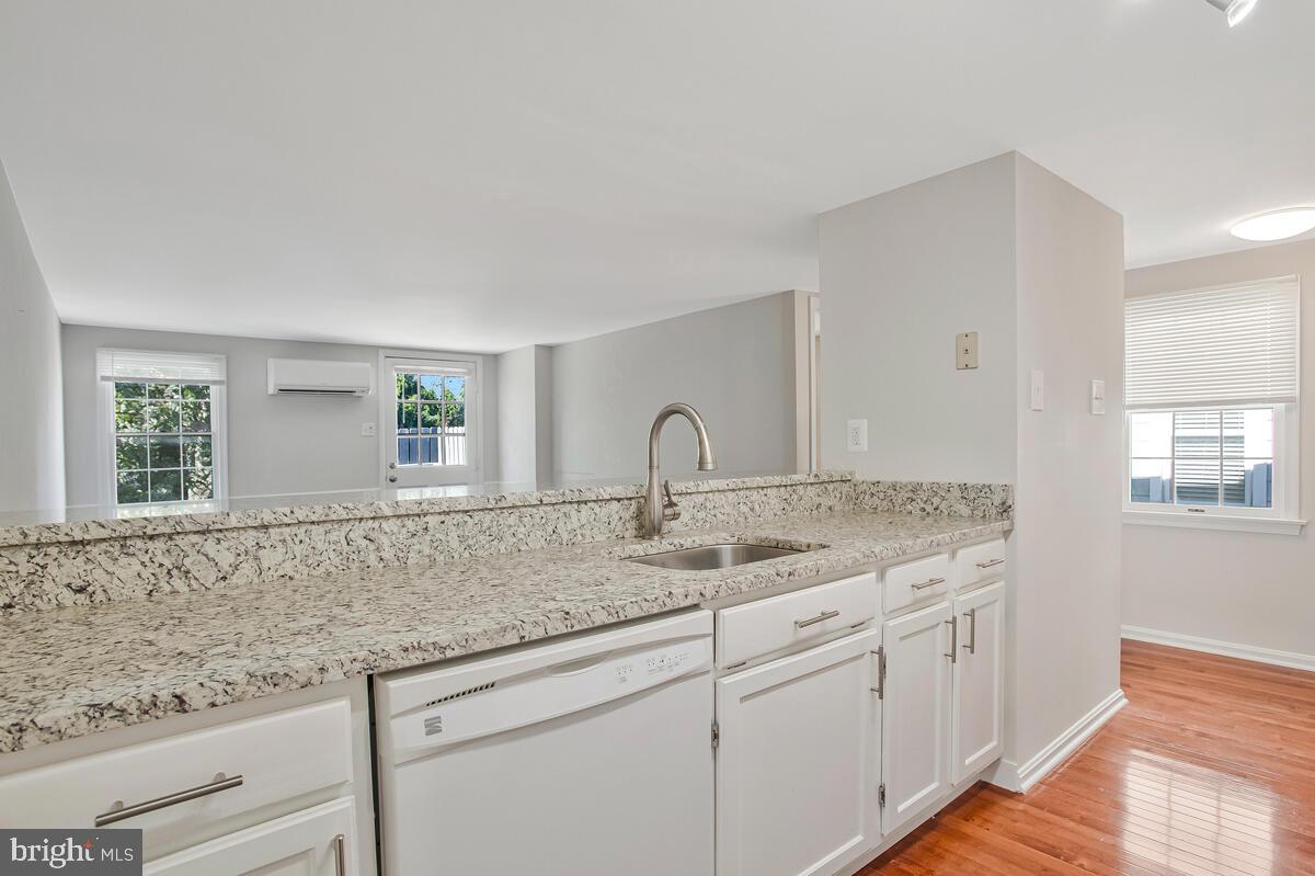 320 Chester Avenue Annapolis, MD 21403 - Photo 21 of 32 a kitchen with granite countertop white cabinets and a window