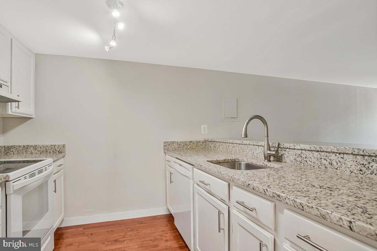 320 Chester Avenue Annapolis, MD 21403 - Photo 24 of 32 a kitchen with granite countertop a sink and a stove