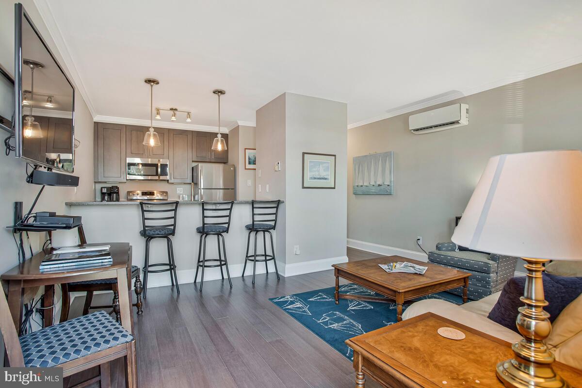 320 Chester Avenue Annapolis, MD 21403 - Photo 5 of 32 a workspace with furniture and wooden floor