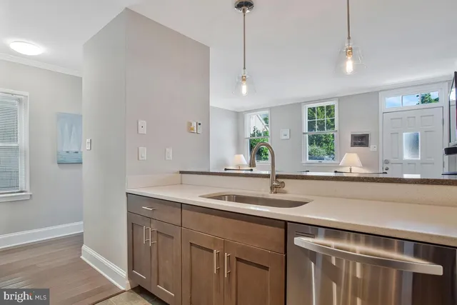 a kitchen with a sink and a window