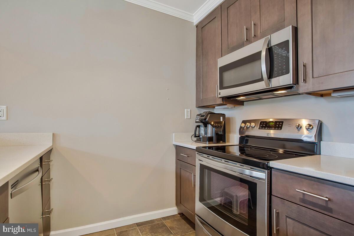 320 Chester Avenue Annapolis, MD 21403 - Photo 9 of 32 a kitchen with a stove and a microwave