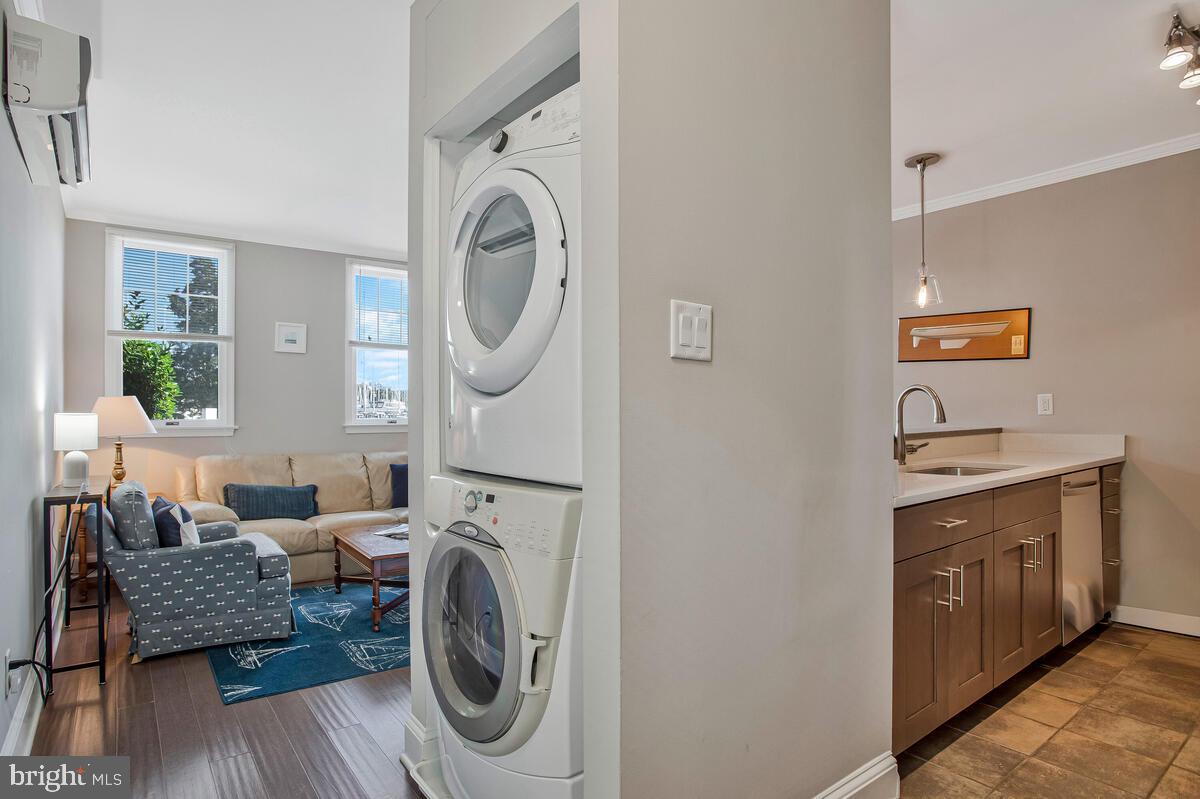 320 Chester Avenue Annapolis, MD 21403 - Photo 10 of 32 a utility room with dryer washer and a view of living room