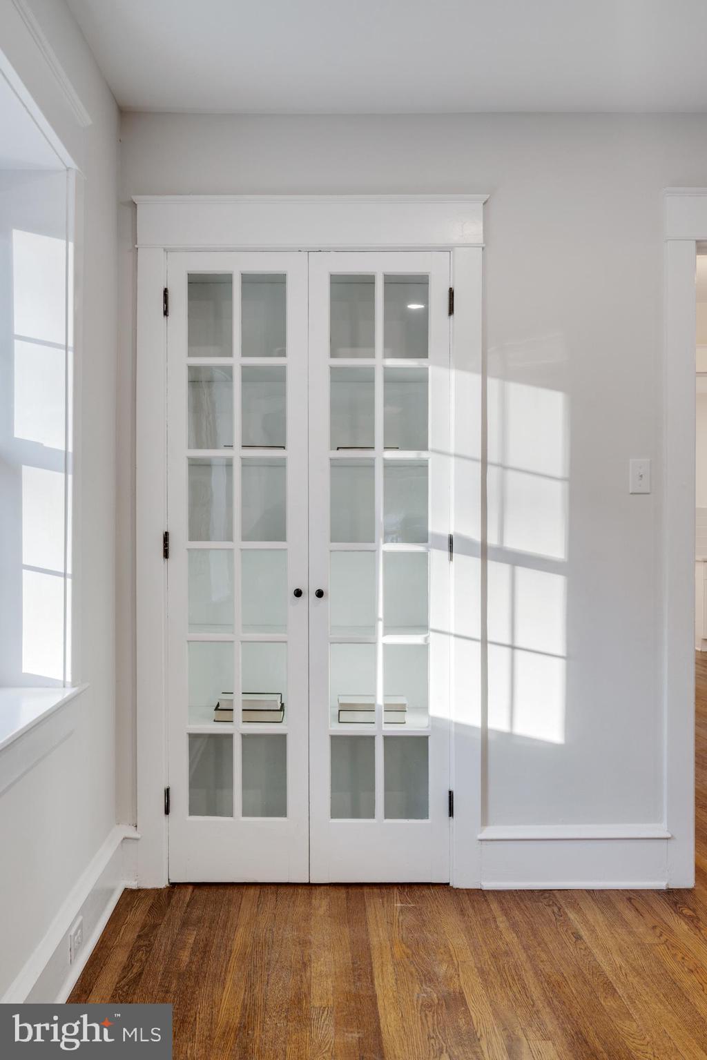 39 North Rolling Road Springfield, PA 19064 - Photo 15 of 119 a view of an empty room with wooden floor and windows