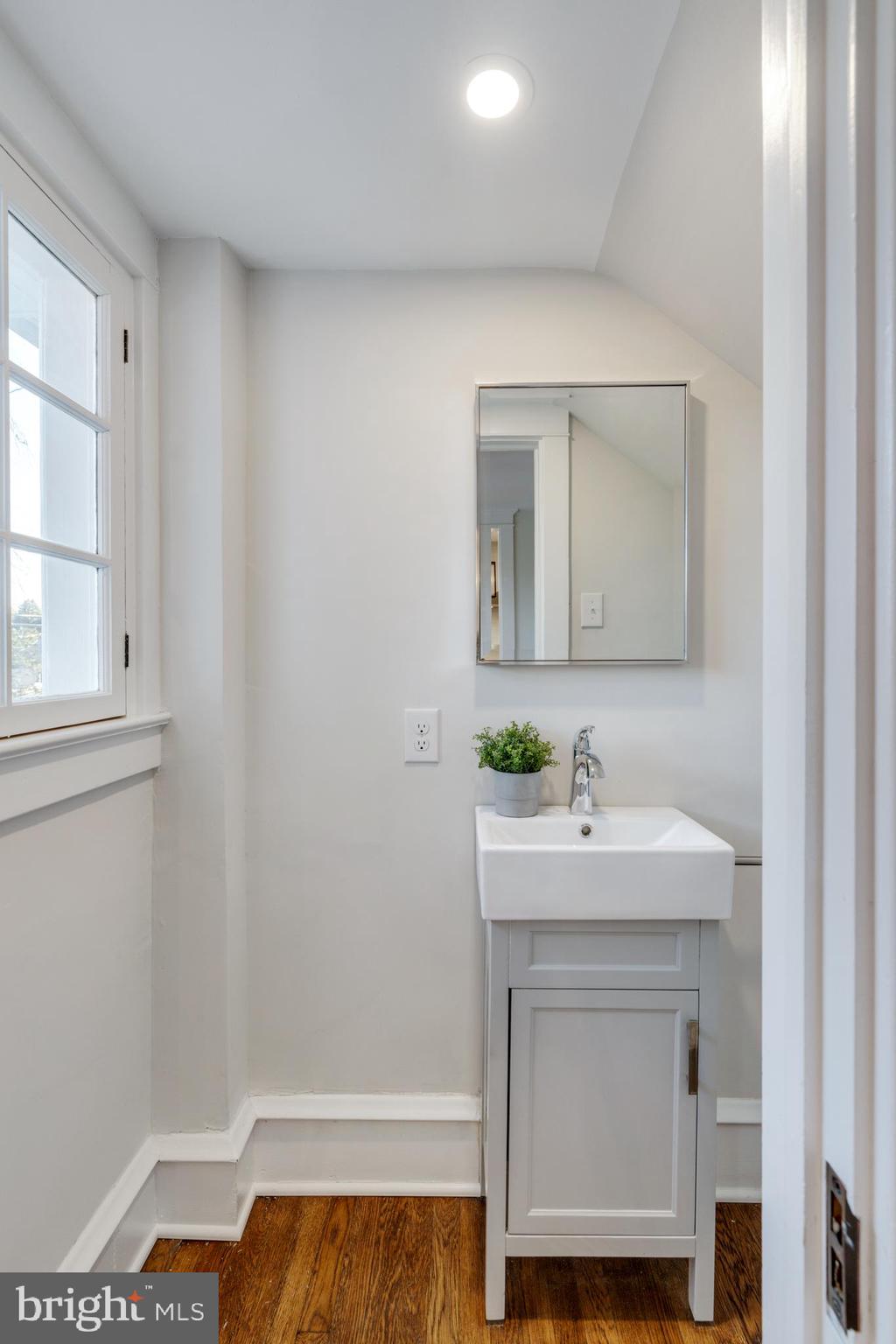 39 North Rolling Road Springfield, PA 19064 - Photo 48 of 119 a bathroom with a sink a vanity and a mirror