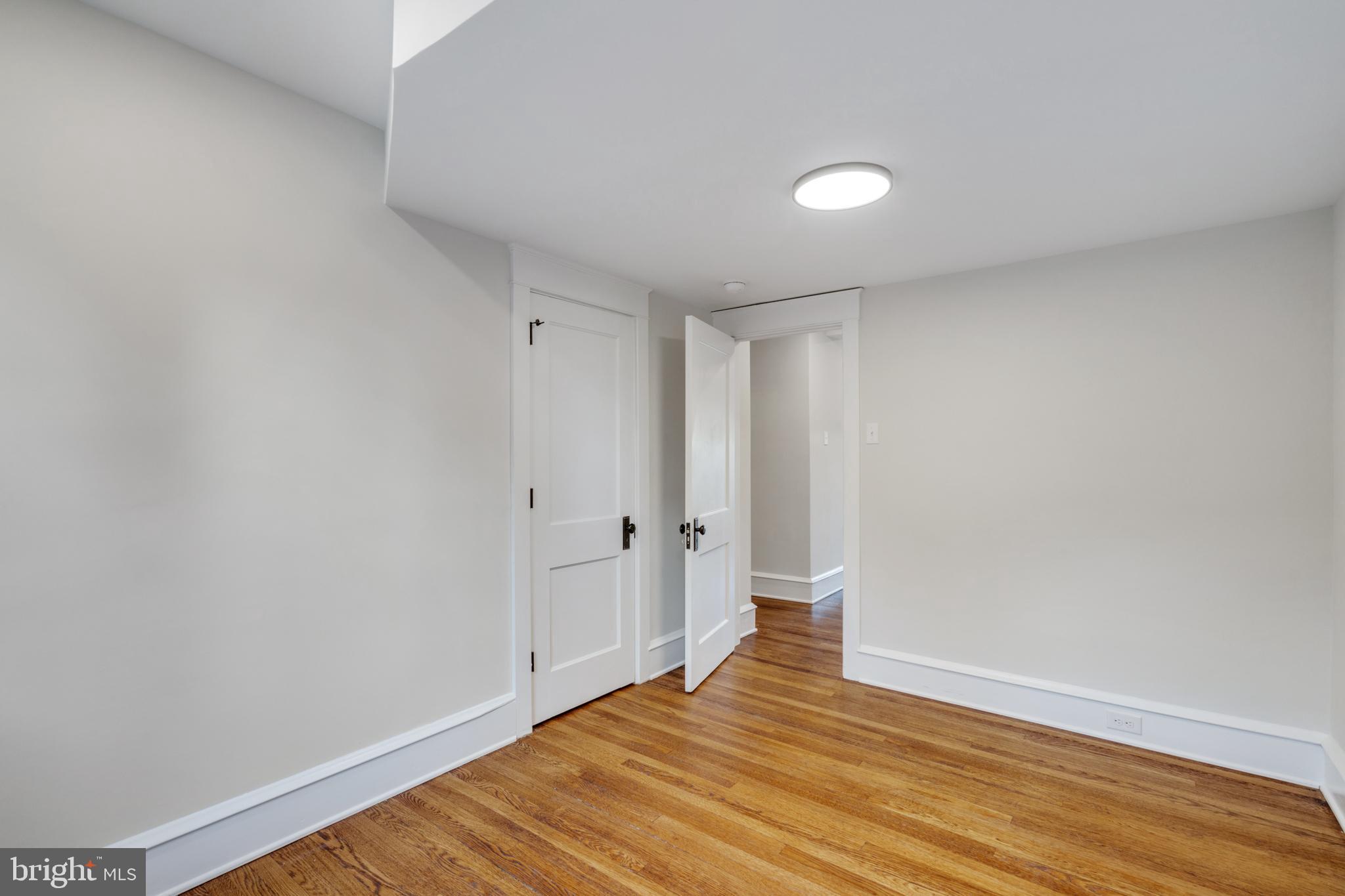 39 North Rolling Road Springfield, PA 19064 - Photo 69 of 119 a view of an empty room and wooden floor