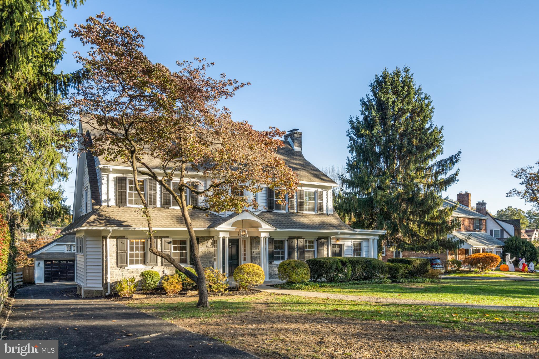 39 North Rolling Road Springfield, PA 19064 - Photo 7 of 119 a front view of residential houses with yard and trees
