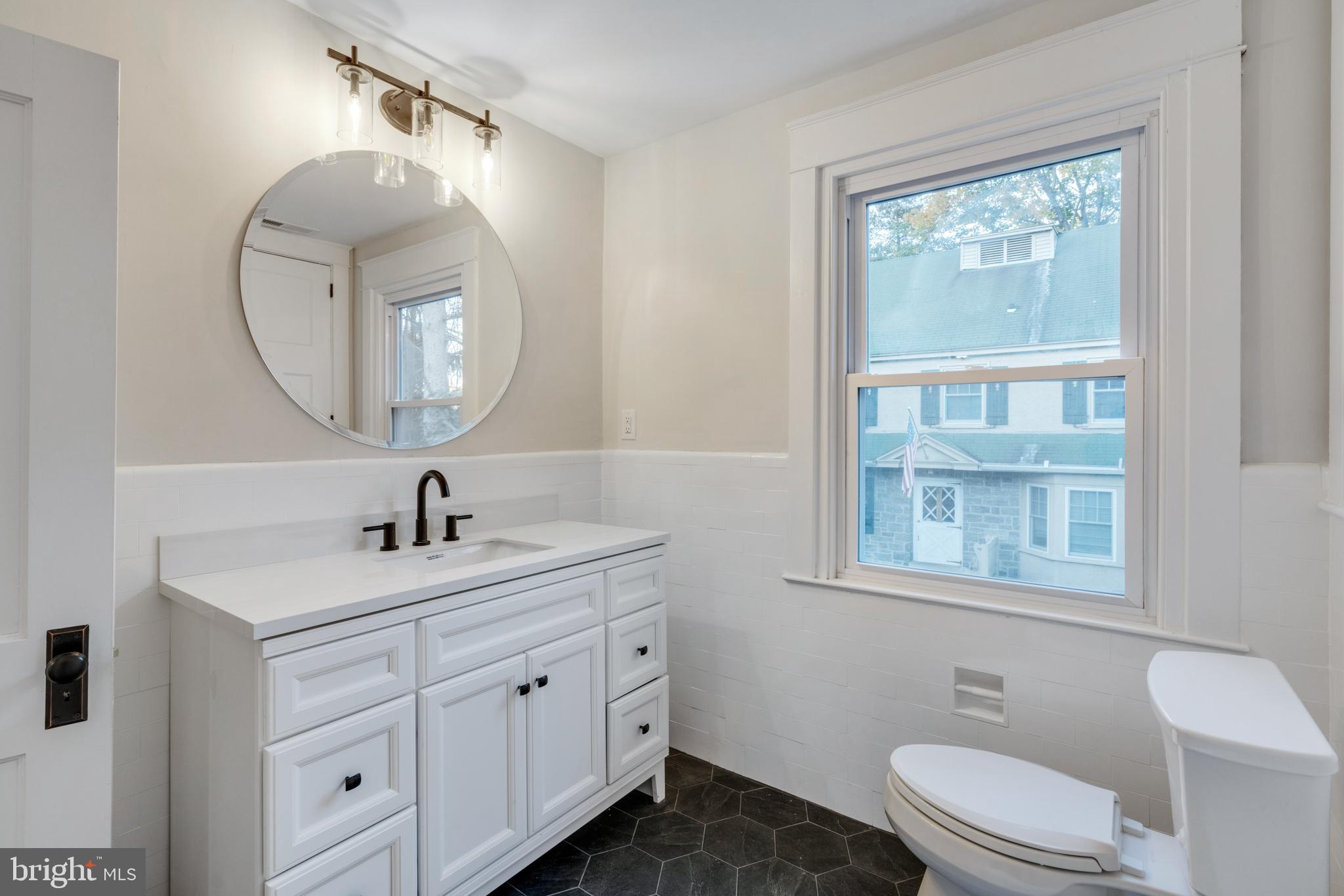 39 North Rolling Road Springfield, PA 19064 - Photo 74 of 119 a bathroom with a toilet sink and mirror