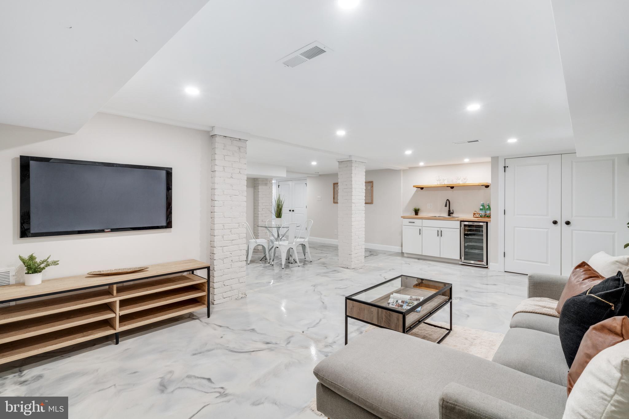 39 North Rolling Road Springfield, PA 19064 - Photo 86 of 119 a living room with furniture and a flat screen tv
