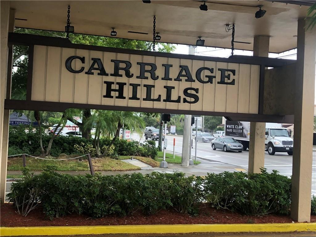 100 Berkley Road, Unit 104 Hollywood, FL 33024 - Photo 1 of 17 COMPLEX ENTRANCE