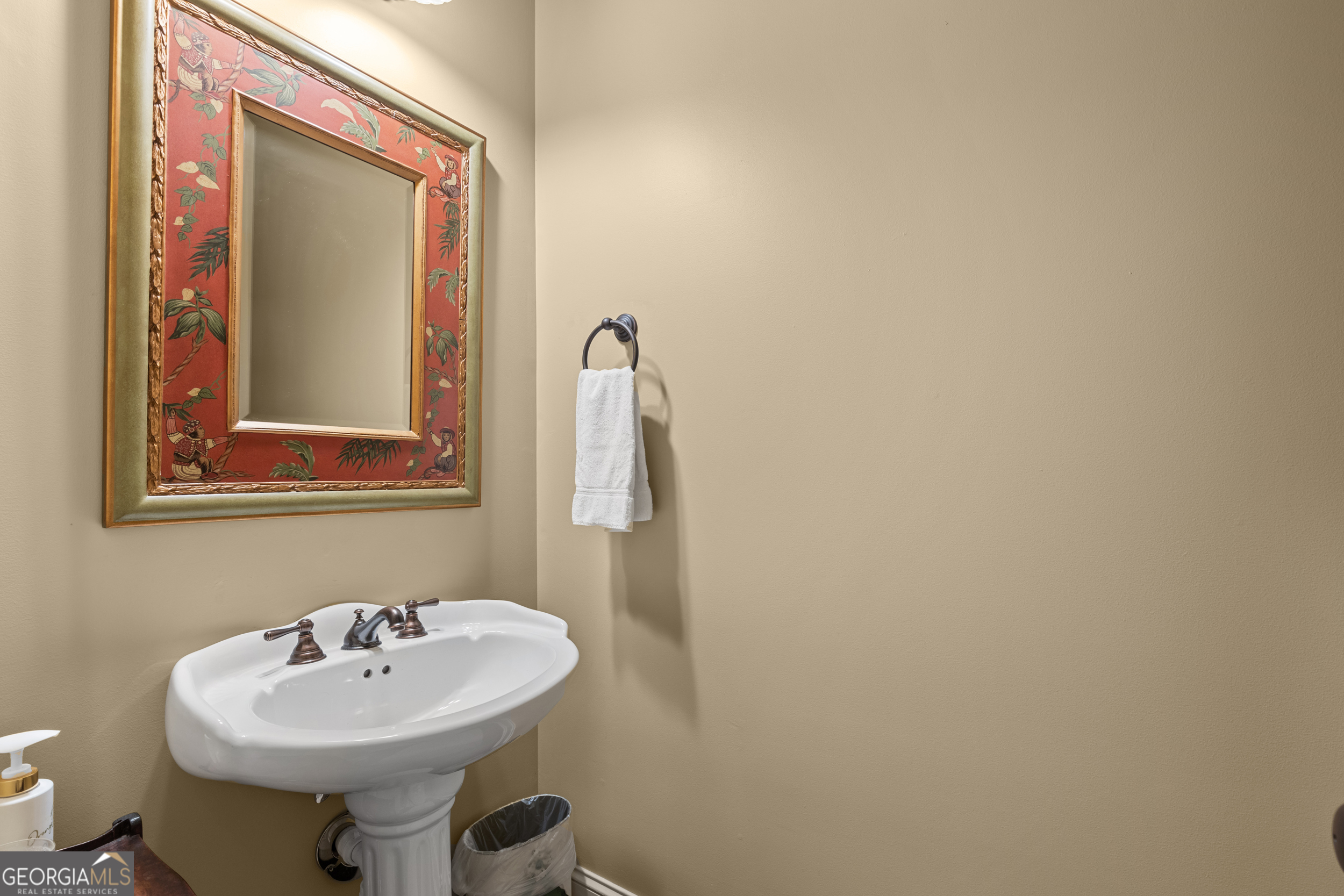 96 Fair View Drive Clayton, GA 30525 - Photo 25 of 66 a bathroom with a sink a mirror and a toilet