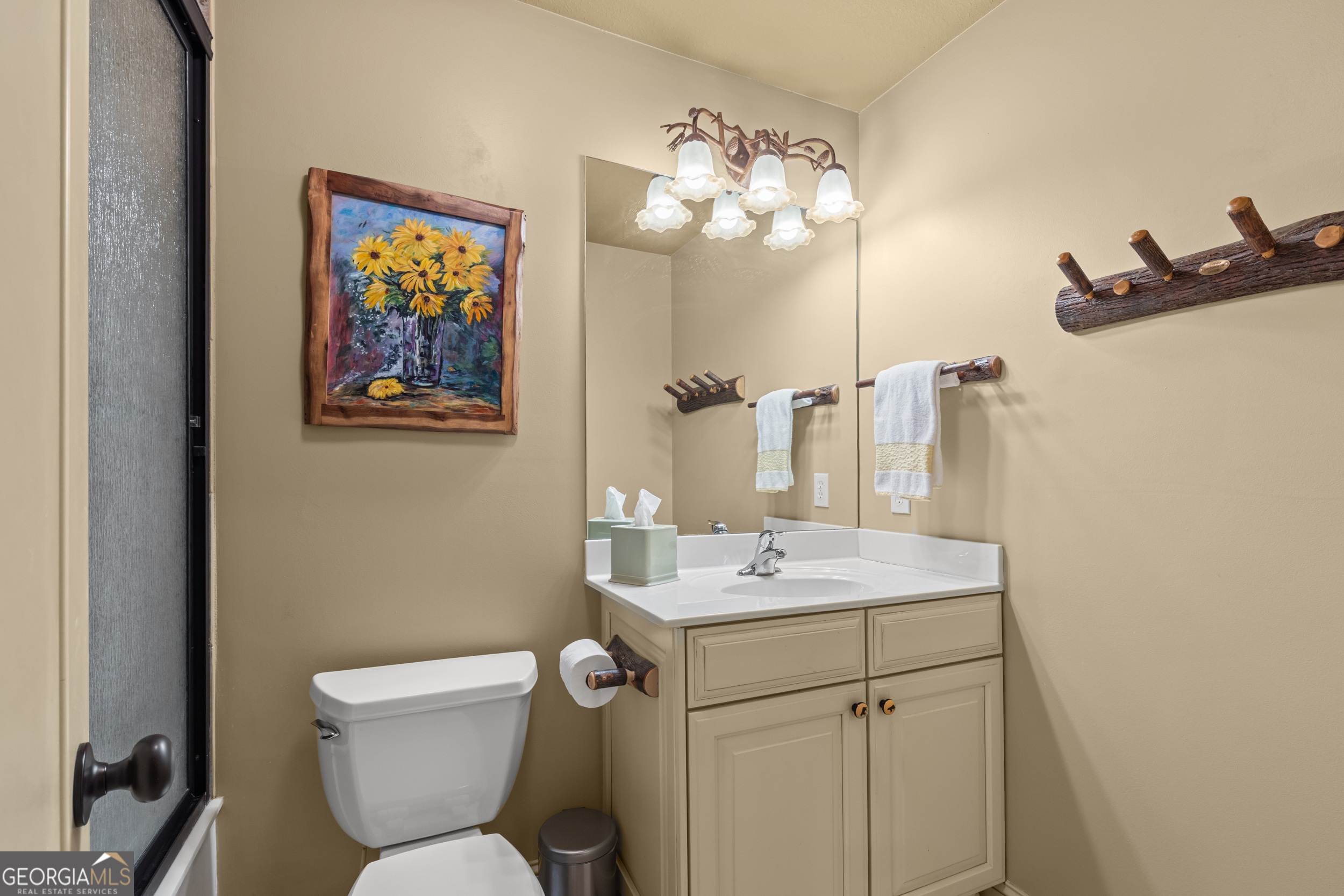 96 Fair View Drive Clayton, GA 30525 - Photo 33 of 66 a bathroom with a toilet a sink and mirror