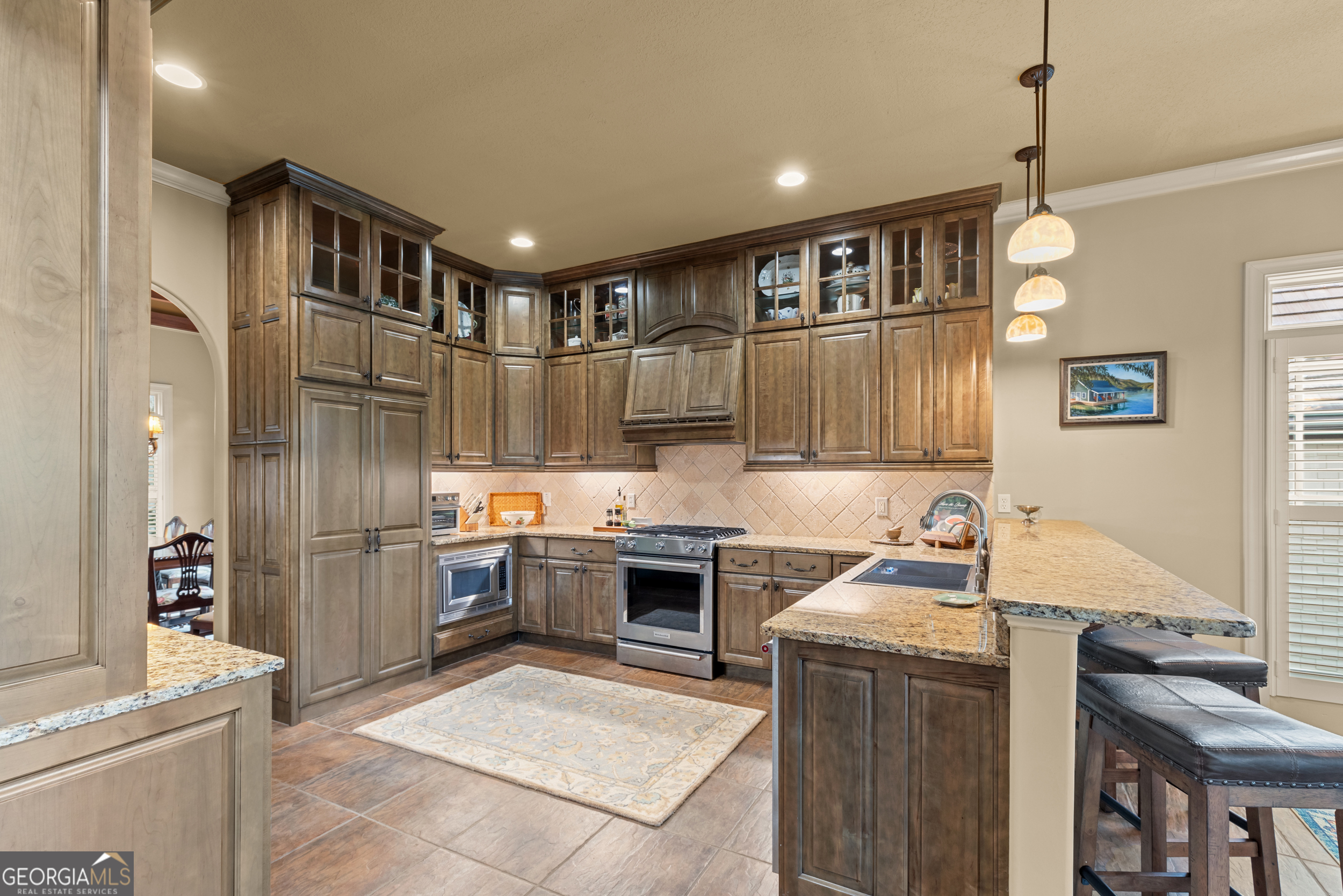 96 Fair View Drive Clayton, GA 30525 - Photo 9 of 66 a kitchen with kitchen island granite countertop a sink cabinets and stainless steel appliances