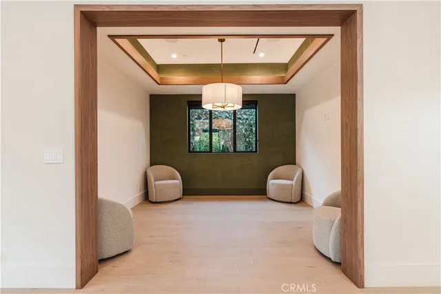 a room with a couch and a chandelier