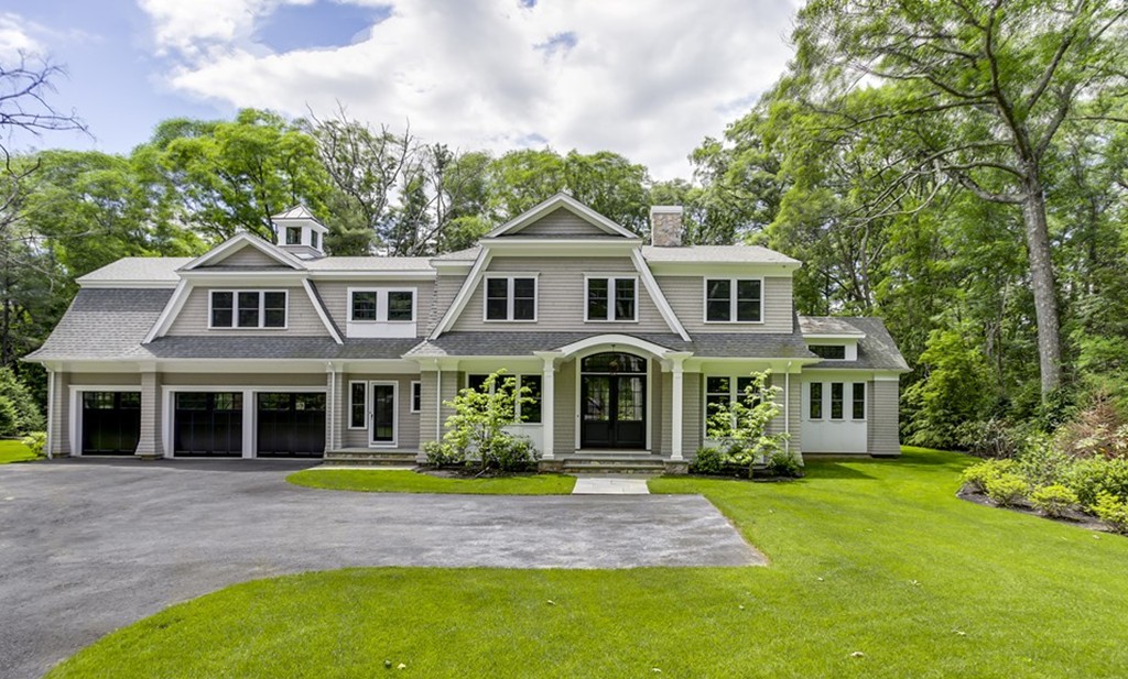 77 Autumn Road Weston, MA 02493 - Photo 1 of 24 a front view of a house with a garden