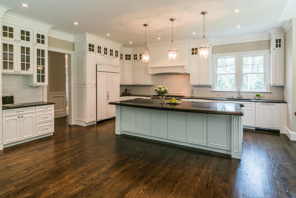 77 Autumn Road Weston, MA 02493 - Photo 11 of 24 a kitchen with stainless steel appliances granite countertop a sink a stove and a wooden floors