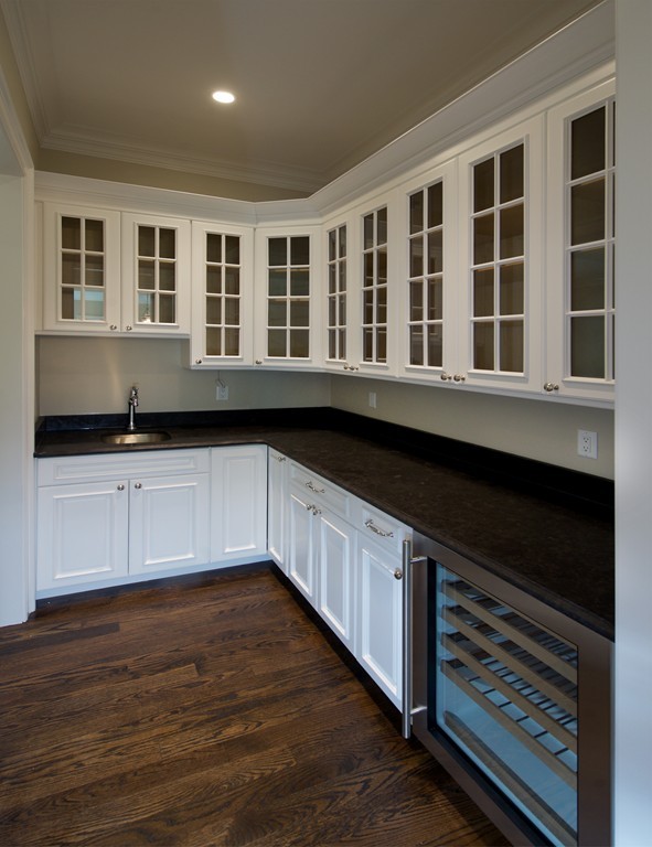 77 Autumn Road Weston, MA 02493 - Photo 15 of 24 a kitchen with a sink and cabinets