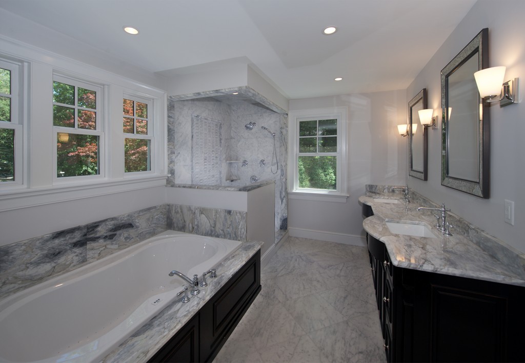 77 Autumn Road Weston, MA 02493 - Photo 18 of 24 a bathroom with a granite countertop tub sink and mirror