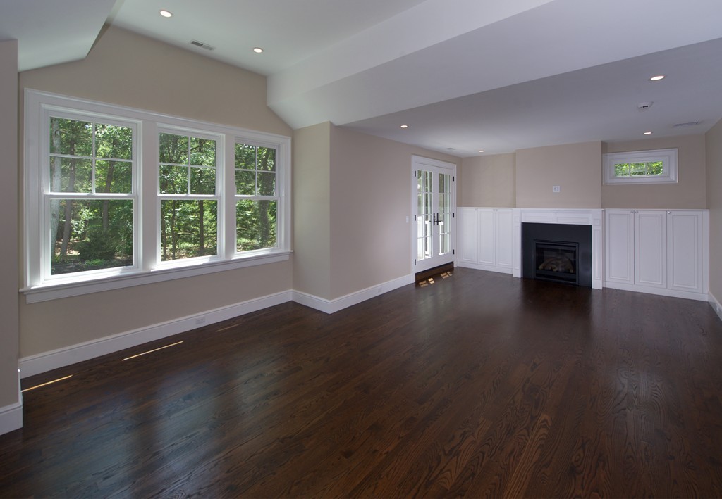 77 Autumn Road Weston, MA 02493 - Photo 19 of 24 a view of a livingroom with wooden floor and a window