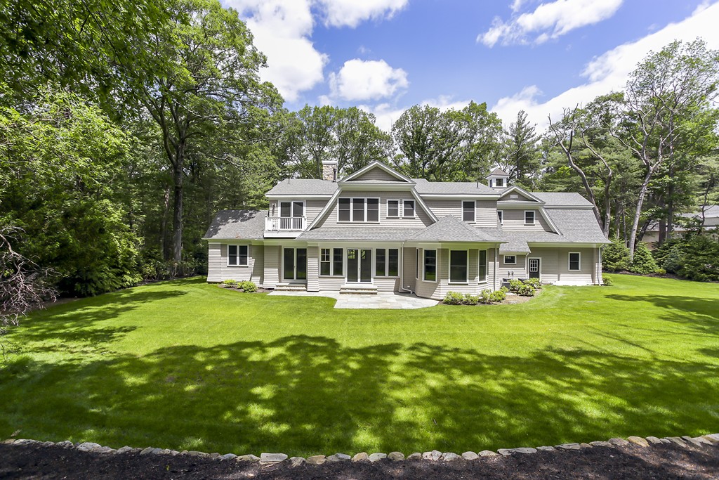77 Autumn Road Weston, MA 02493 - Photo 2 of 24 a front view of a house with a garden